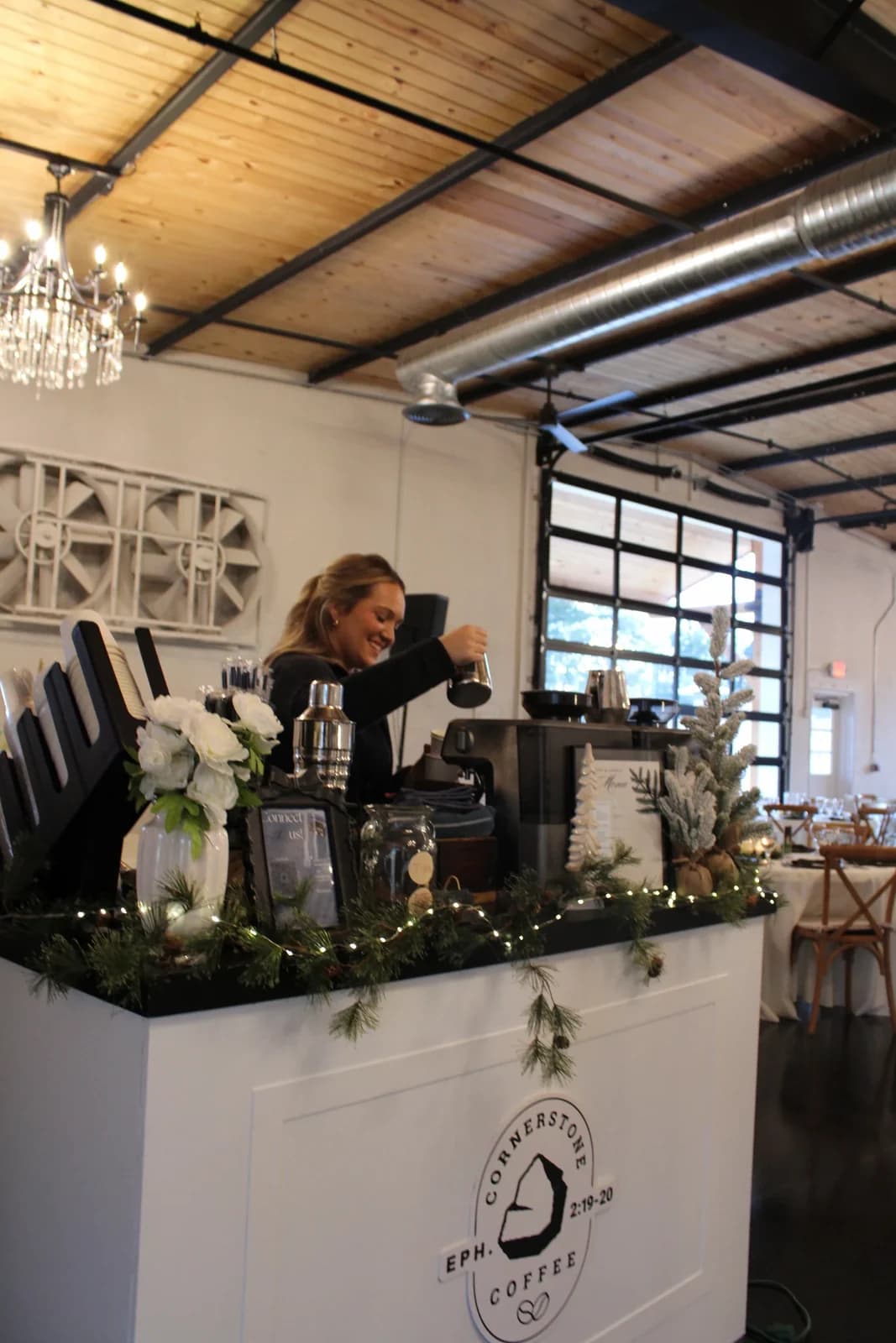 A barista pulling espresso shots at the Cornerstone Coffee event bar