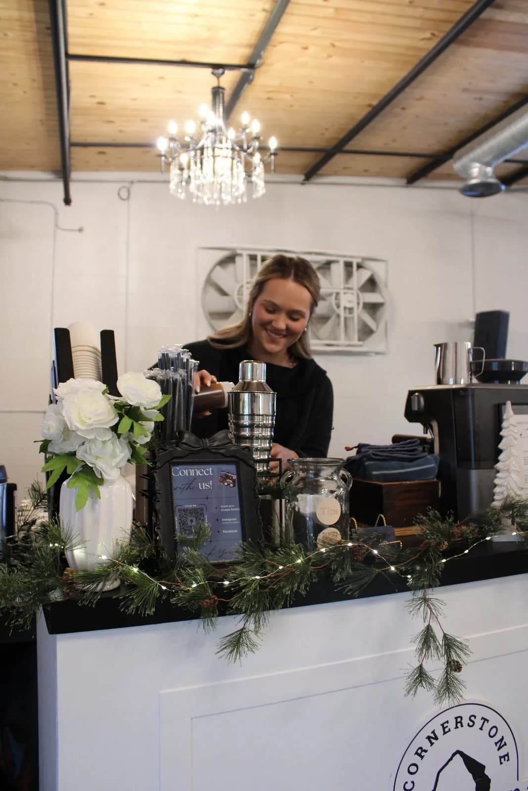A Cornerstone Coffee barista preparing espresso drinks for guests at an event