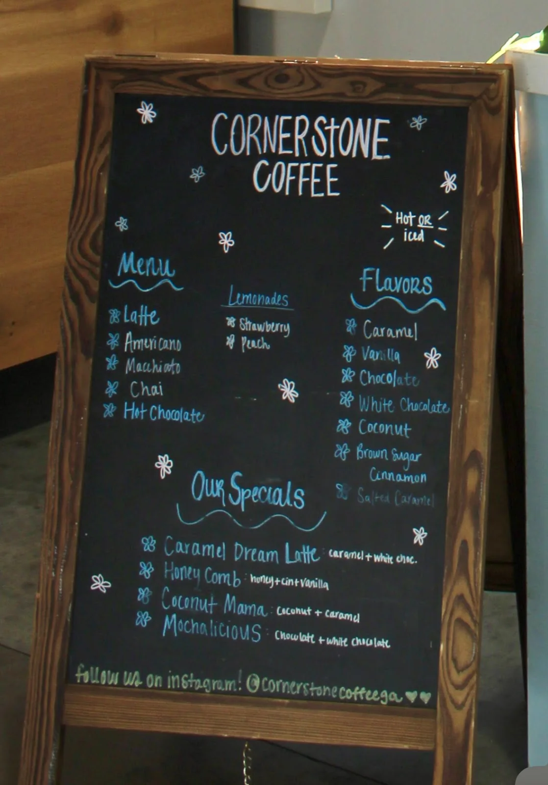 Cornerstone Coffee's hand-lettered chalkboard menu listing espresso drinks, flavors and specialty lattes