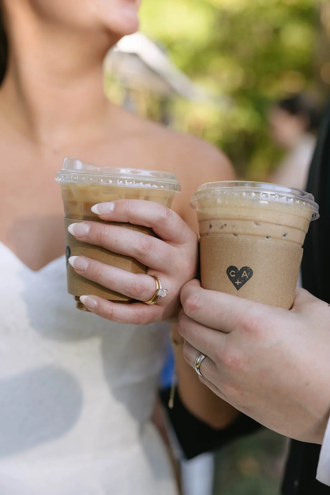 Wedding guests toasting with iced coffees from the Cornerstone Coffee bar